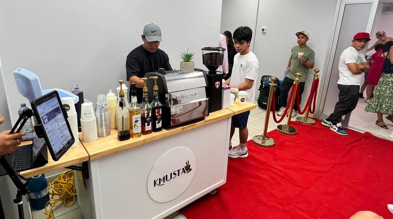 The Kmusta cart set up on a red carpet at a birthday celebration