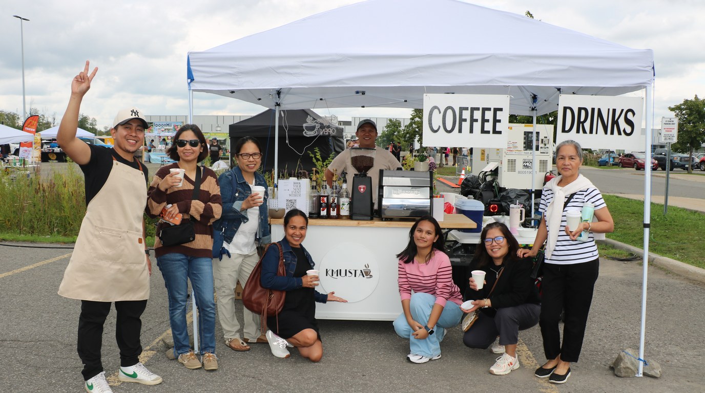 Guests gathered at the Kmusta cart during a community celebration